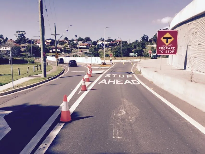 Cones and a Prepare to Stop sign on a closed road
