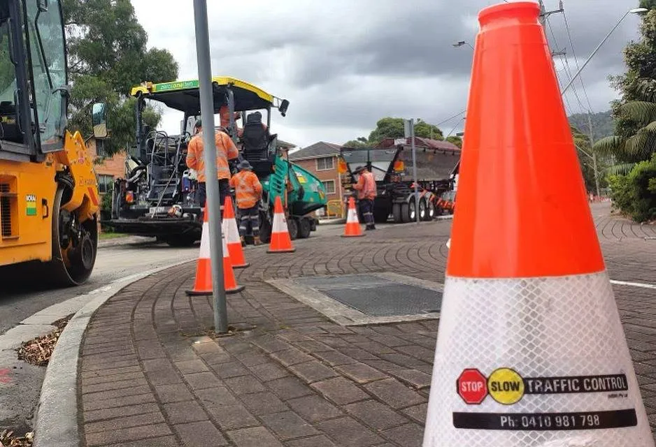 An SSTC cone beside road resurfacing works