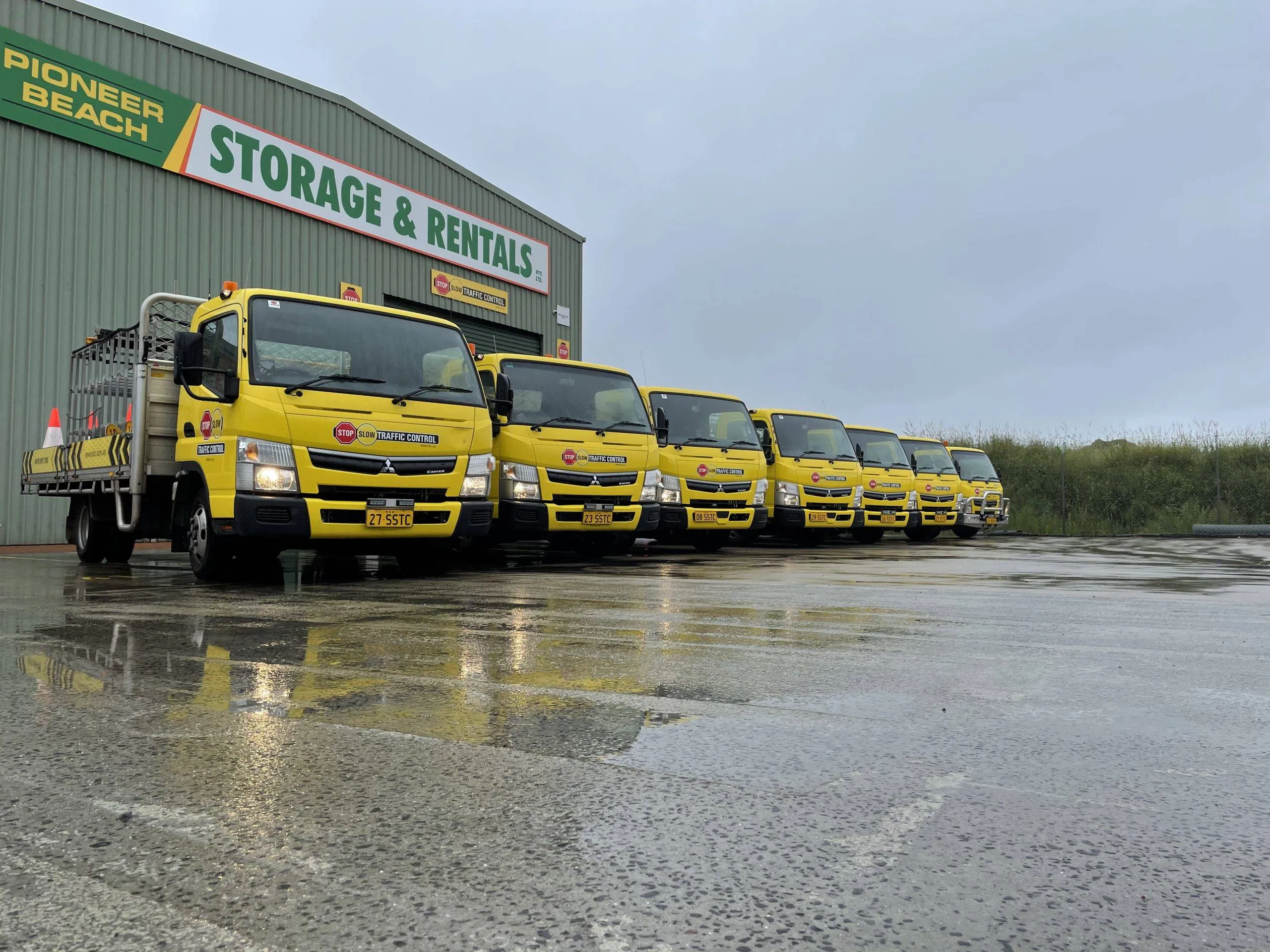A row of SSTC trucks at the depot