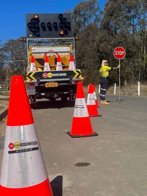 A STOP SLOW bat and an arrow board on an SSTC truck